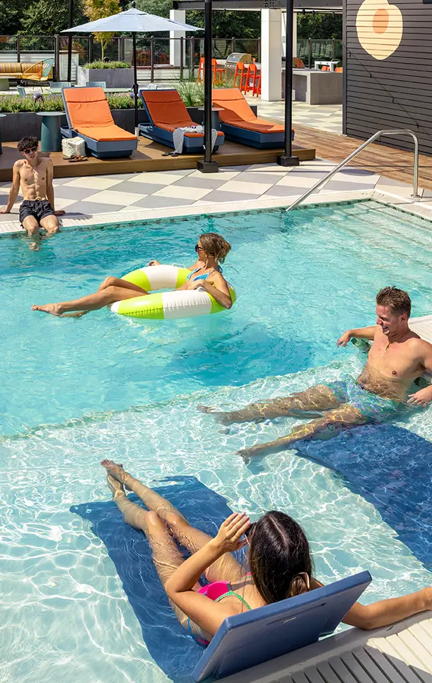 Friends hanging out in the pool