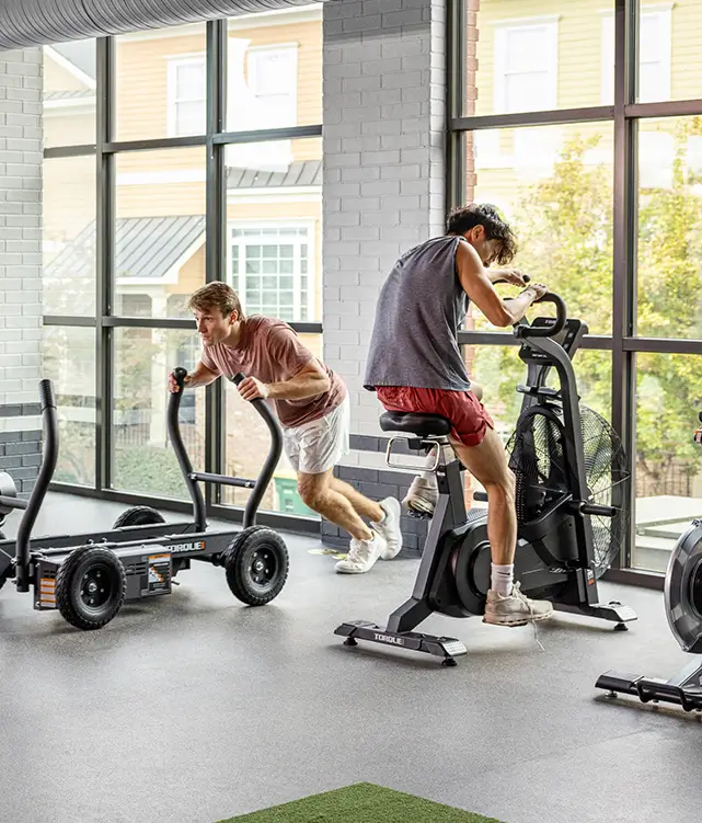 Friends exercising at the gym