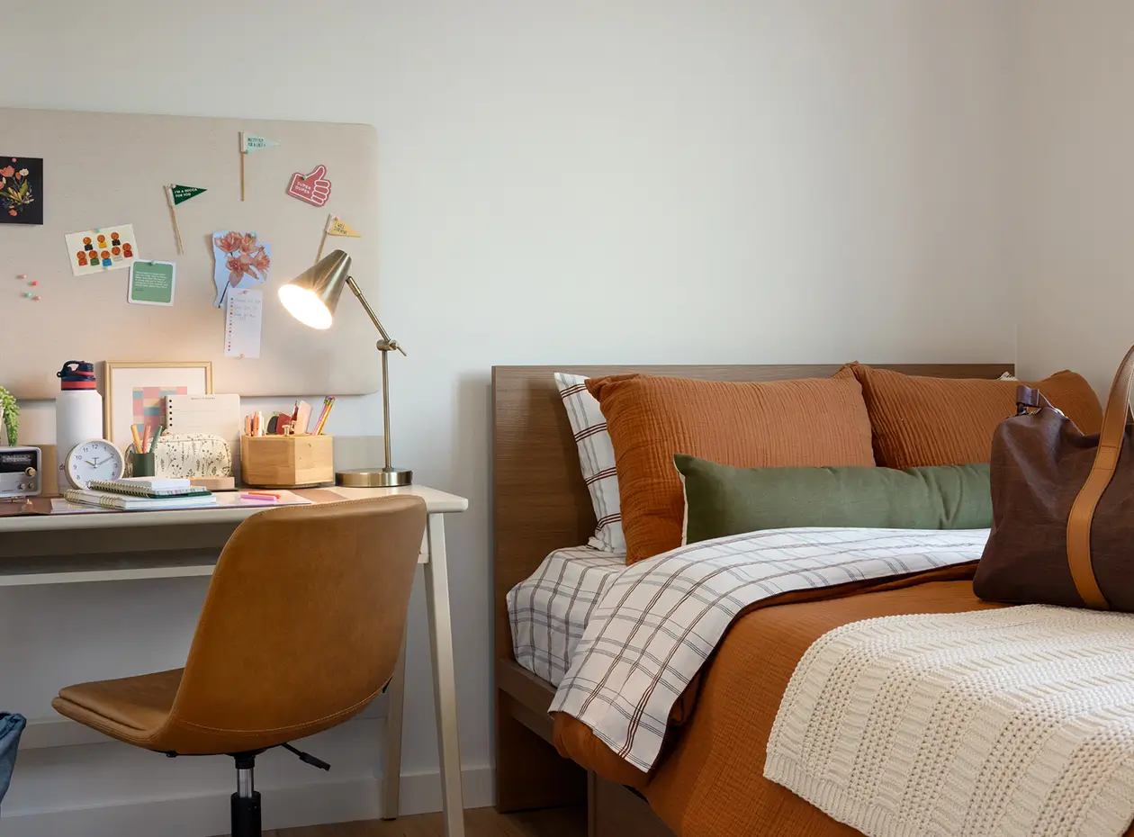 Fully furnished room with bed, desk and chair