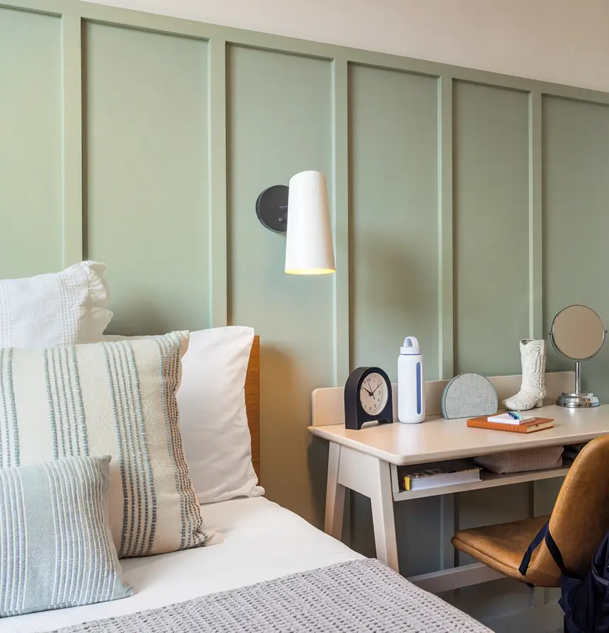 Fully furnished room with bed, desk and chair