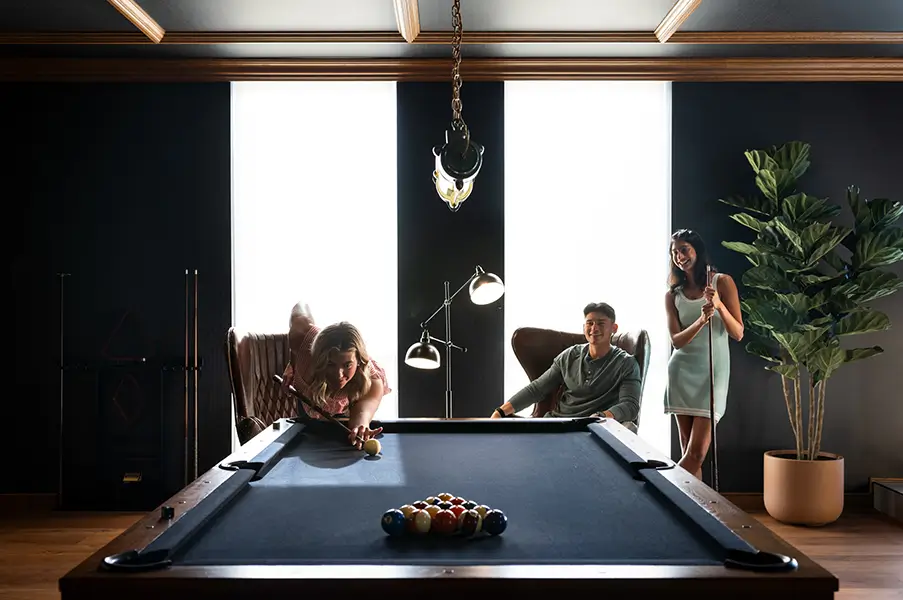 Young people playing pool